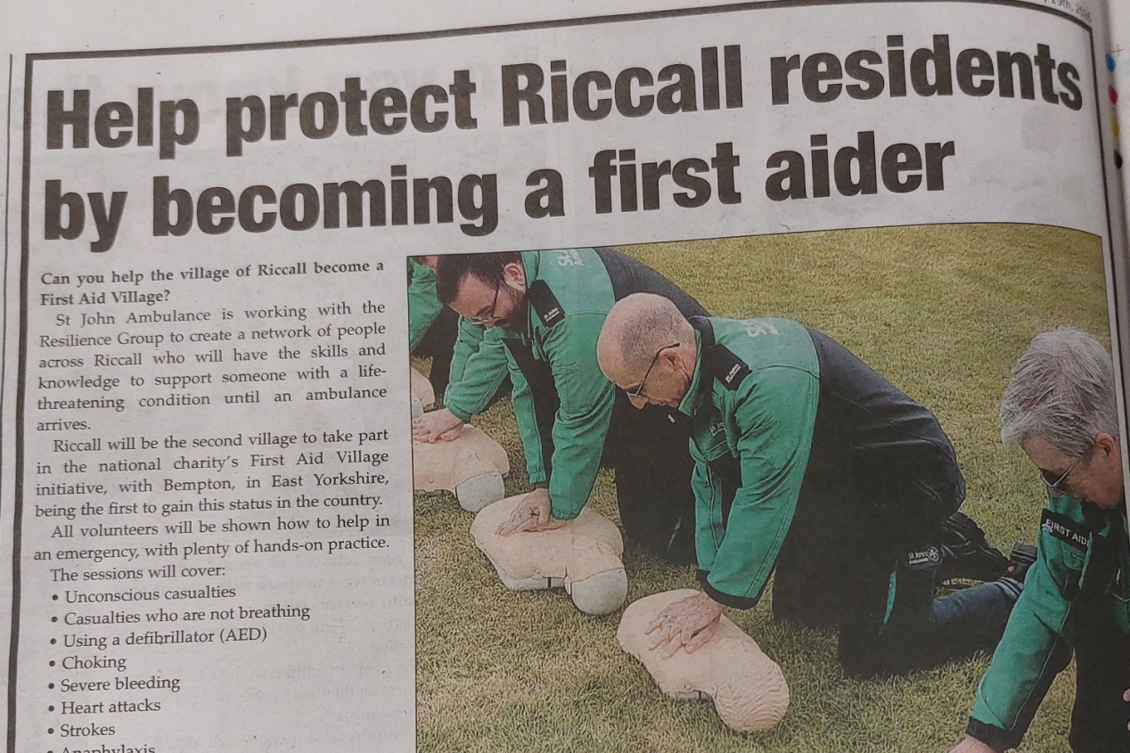Newspaper cropping of people doing first aid training